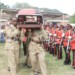 MDF pall-bearers carry Mpasu’s casket during the funeral