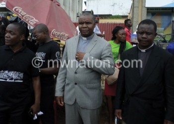 Mbolembole (grey suit) and Muhiwa (L) with other Blantyre Synod clergy members