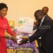 Mutharika (L) receives the donation from Mvula