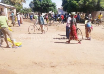 Despite living in fear, people go about their daily 
business in Lukono Village