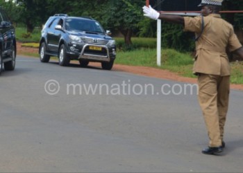 Katunga directs traffic on one of the roads in Lilongwe
