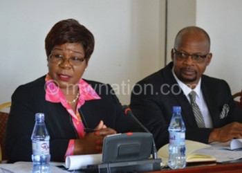 Roka-Mauwa (L) and her team address members of 
Budget and Finance Committee of Parliament