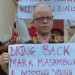 Flashback: Massa is seen with a placard during the search for  Mark Masambuka who was later found  murdered