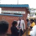 Luke International officials and teachers admire the newly-built toilet