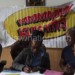 Kapolo (2ndL) signs the new deal as an official from Cori Shiraz Ahmed (L), Bakali (2ndR) and Diamonds treasurer Bertha Mazeze (R) look on