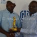 Kalulu (L) receives his trophy from Chapola