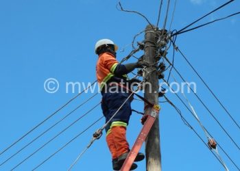 Escom workers fixing transmission lines