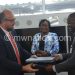 Toulmin and Kapondamg'aga exchange documents
 after the signing ceremony