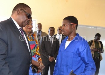 President Peter Mutharika (L) believes technical skills
 empower the youth