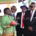 Mutharika (R) gets a briefing at one of the pavilions