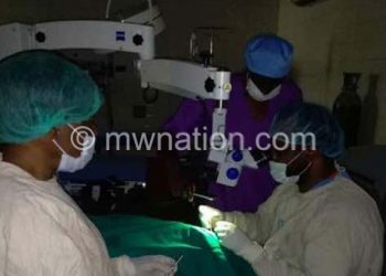The operation in progress under cell phone lighting