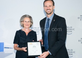 Quinn (R) gets the prestigious award from Schwab