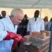 Mohn lays the foundation brick as Muluzi and others look on