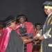 The President presents a doctorate to Florence Thomo Mamba