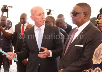 Leferink (L) briefs Mutharika during the launch yesterday