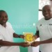Ntelera (L) shares lighter moments with Fifa official