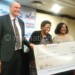 Wedenig (L), Trust Fund board member Temwani Simwaka and NFB head Zandile Shawa pose with a dummy cheque
