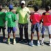 Mtuta poses with the Malawi (green) and Namibia teams