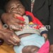 A healthcare worker jabs a child with
newly-introduced malaria vaccine