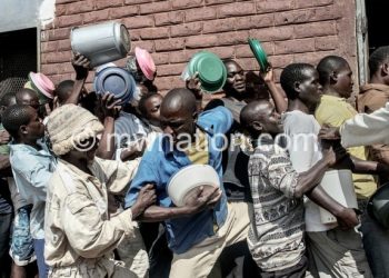 Inmates in a queue for food in this file photo