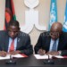 Mwanamvekha (L) and Houngbo sign the agreement in Rome, Italy