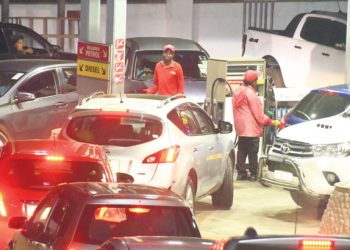 Vehicles queue to refill at a filling station
