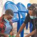 Kwanjana teaches the girls to sew pads