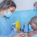 A nurse administers the Covid-19 vaccine on a health worker in Dedza