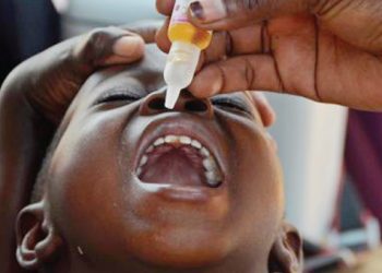 An HSA adminsters polio vaccine