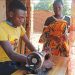 Histon serves a customer in Salima
