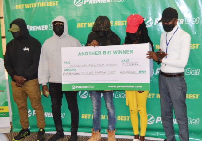 The five winners pose with a dummy cheque