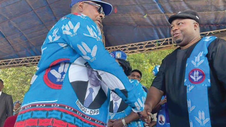 Mutharika (L) greets Nankhumwa at the rally on Saturday
