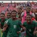 Flames players celebrate their historic victory over Liberia