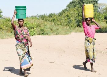 Kachiya (L) and Thayo walk long distances to get drinking water